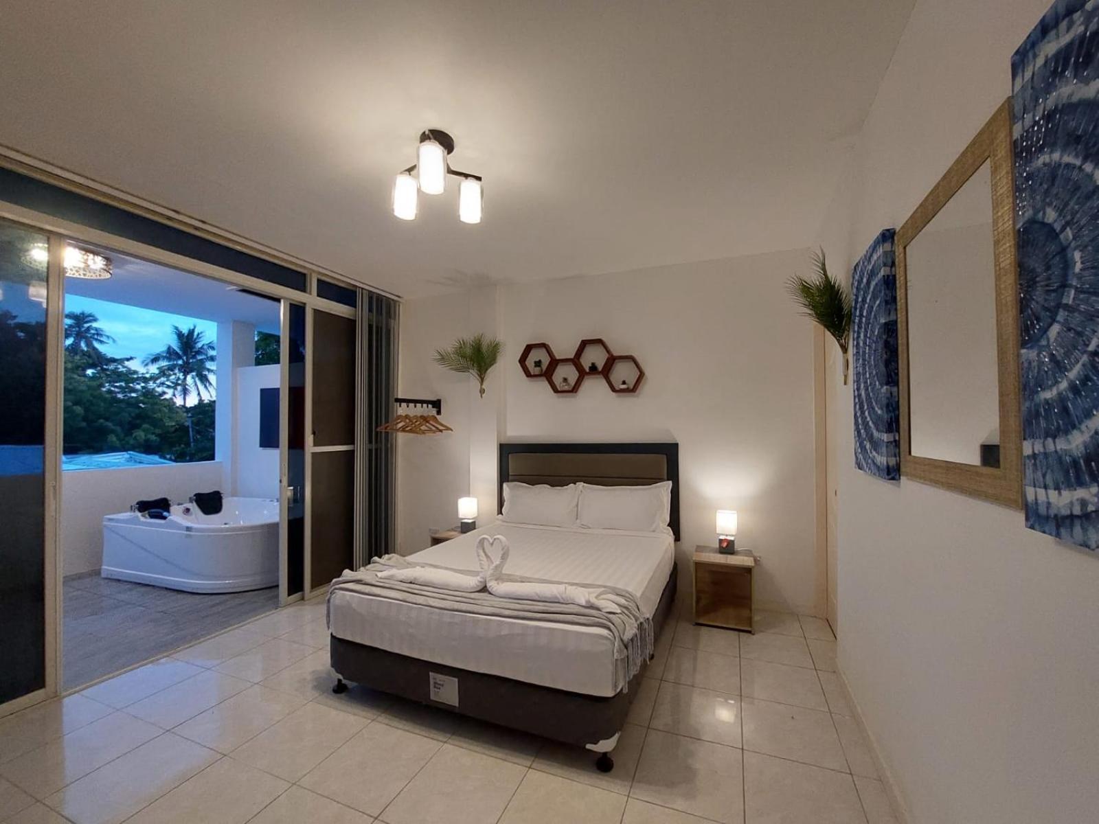 Bonsai Jacuzzi Suites Panglao Bagian luar foto